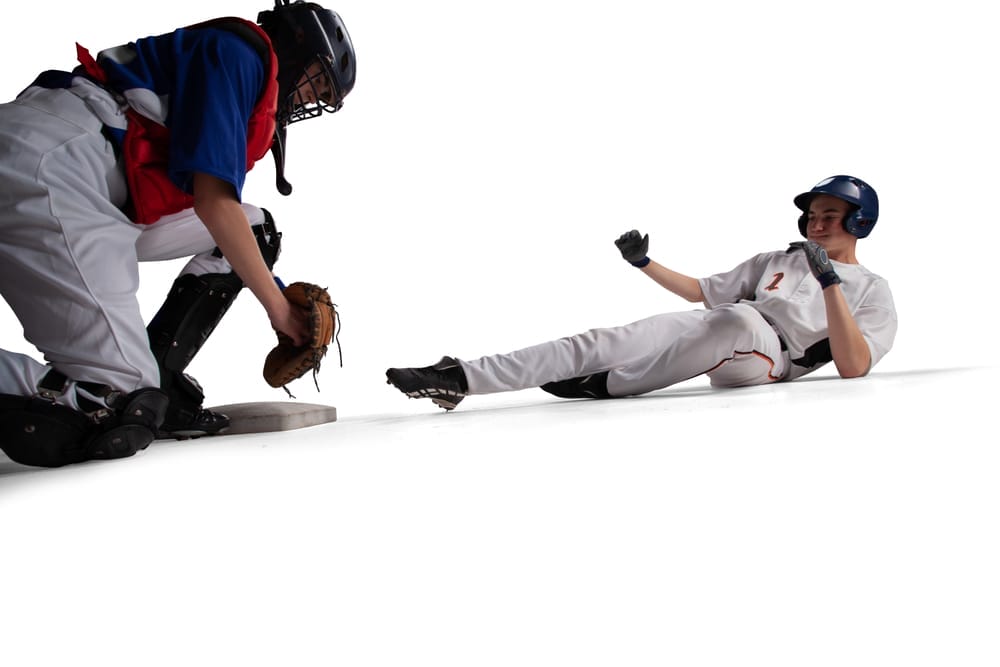 runner being tagged out a home plate