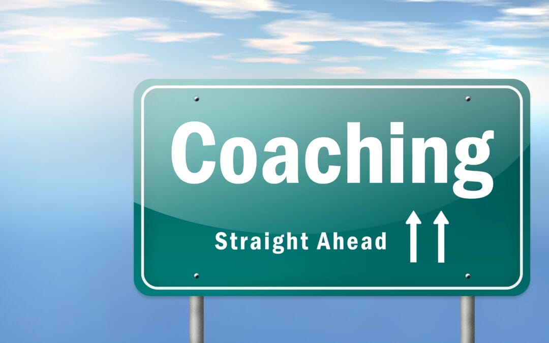 road sign: "coaching ahead"